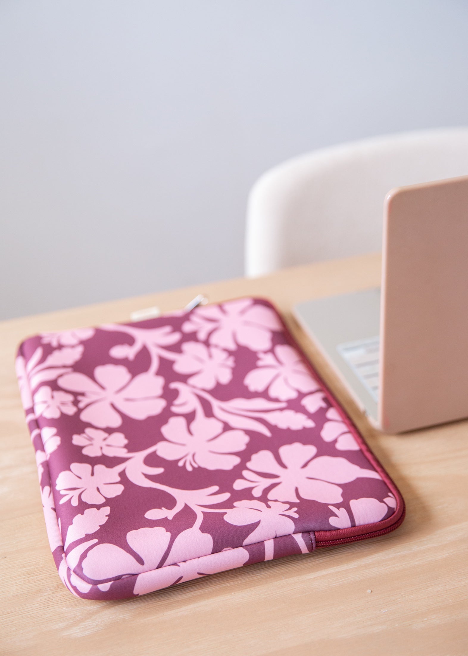 padded laptop case with pink and brown toned hibiscus print