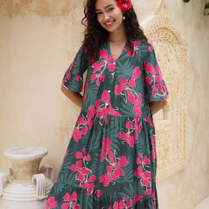 woman with brown hair wearing a dark green half sleeve, oversized maxi dress with button closure, with fern and ginger print