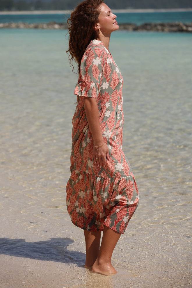 woman with brown hair wearing jade color maxi half sleeve dress with tiare ginger print