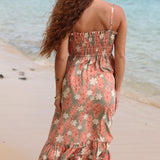 woman with blonde hair wearing jade colored maxi dress with tiare ginger print