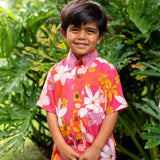 little boy wearing pink mini aloha button up shirt with retro flower print