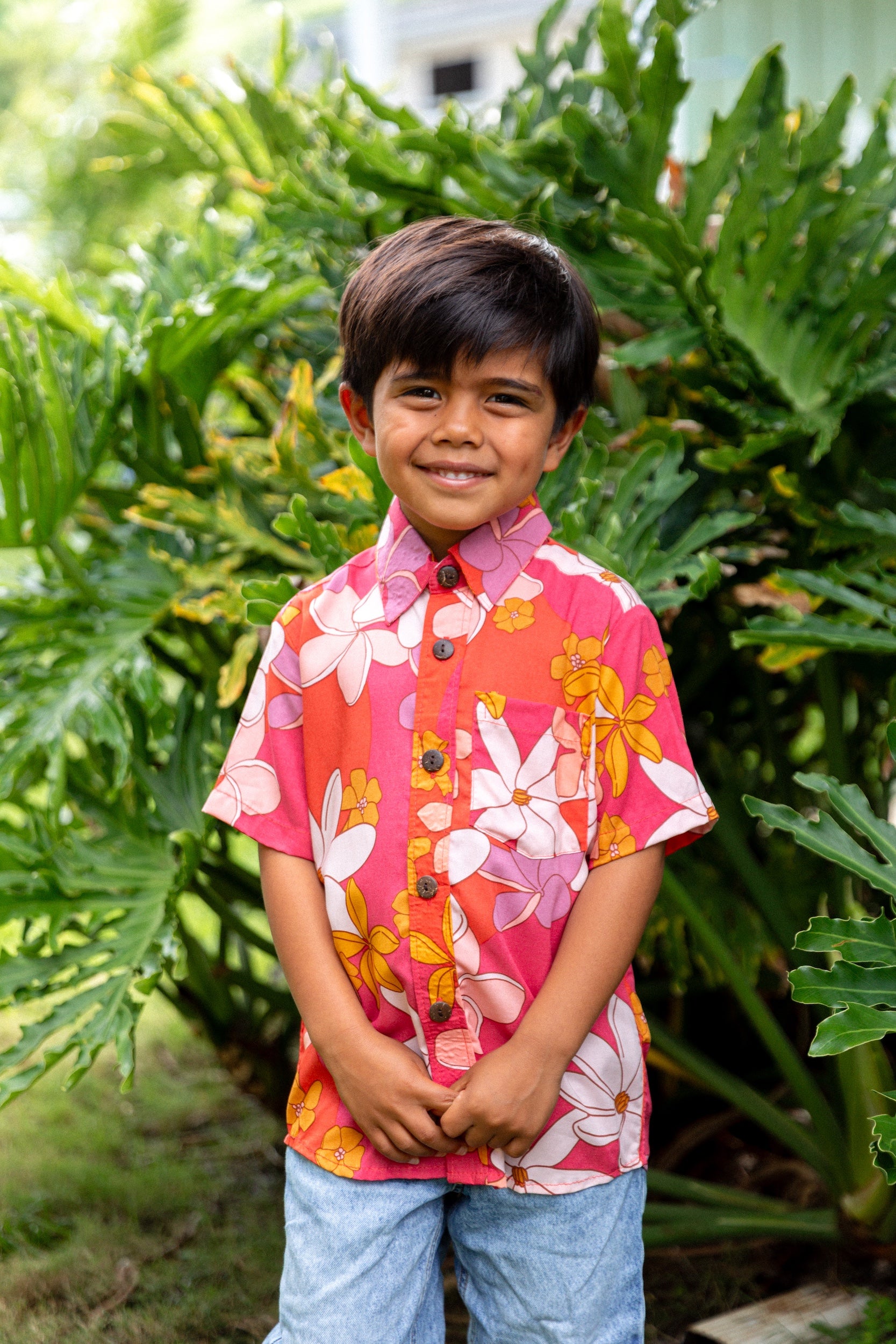 little boy wearing pink mini aloha button up shirt with retro flower print