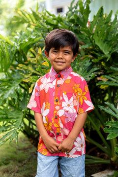 little boy wearing pink mini aloha button up shirt with retro flower print