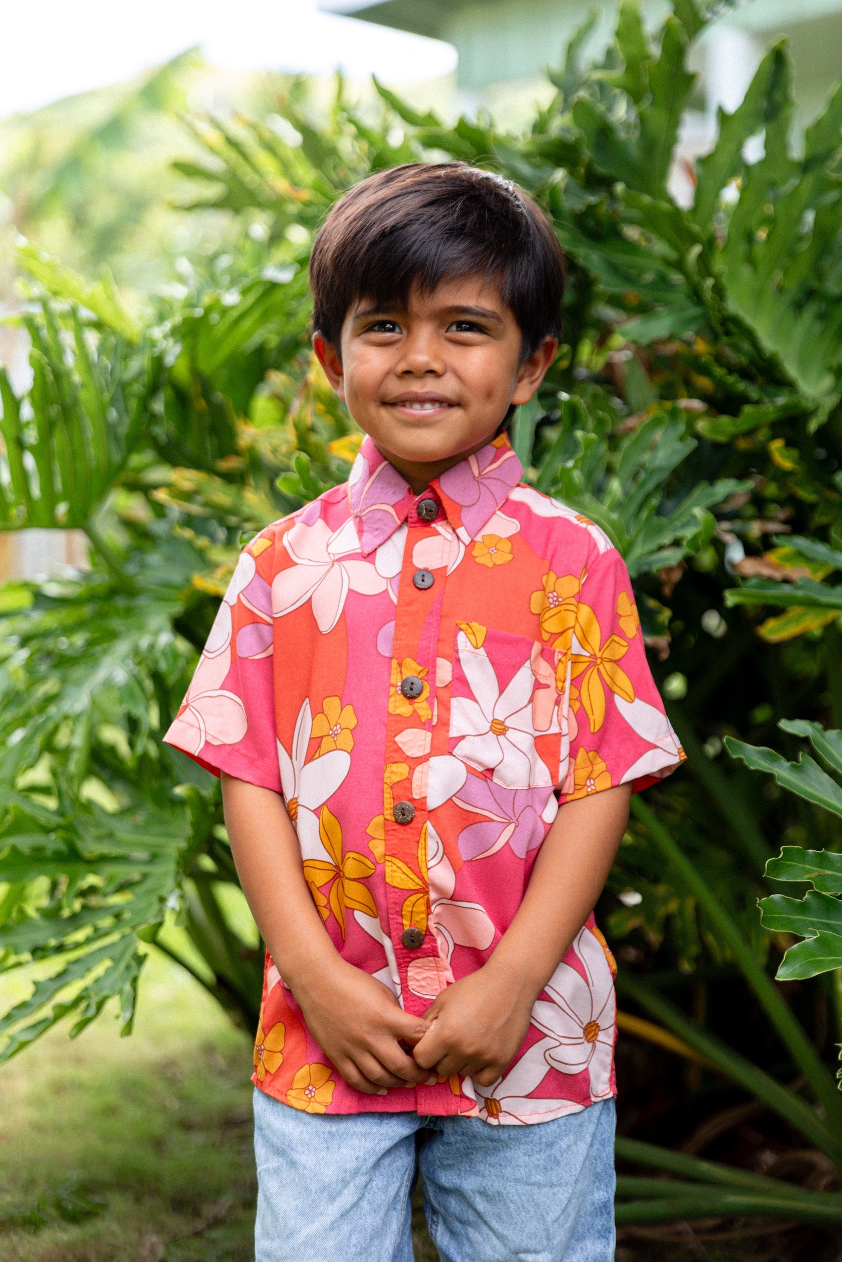 little boy wearing pink mini aloha button up shirt with retro flower print