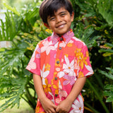 little boy wearing pink mini aloha button up shirt with retro flower print