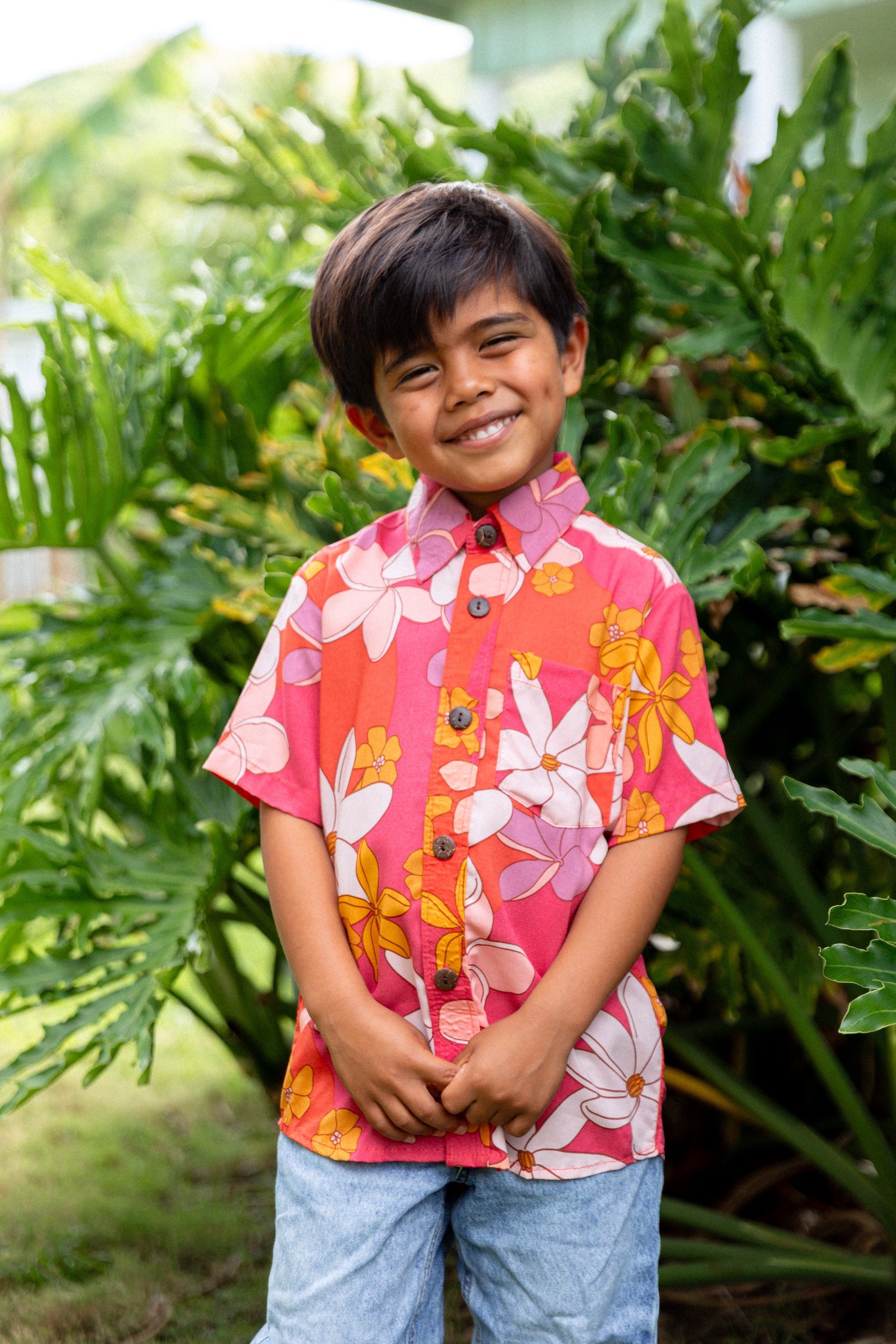 little boy wearing pink mini aloha button up shirt with retro flower print
