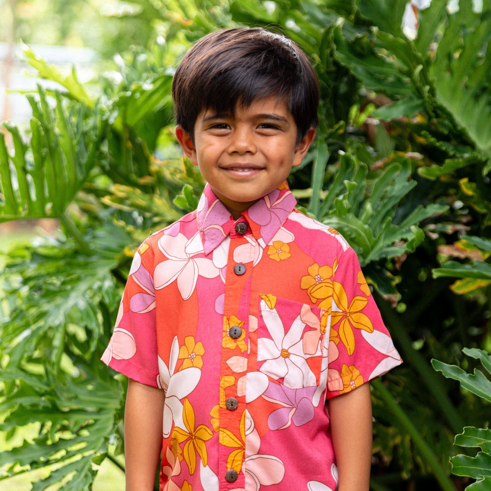 little boy wearing pink mini aloha button up shirt with retro flower print