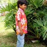 little boy wearing pink mini aloha button up shirt with retro flower print