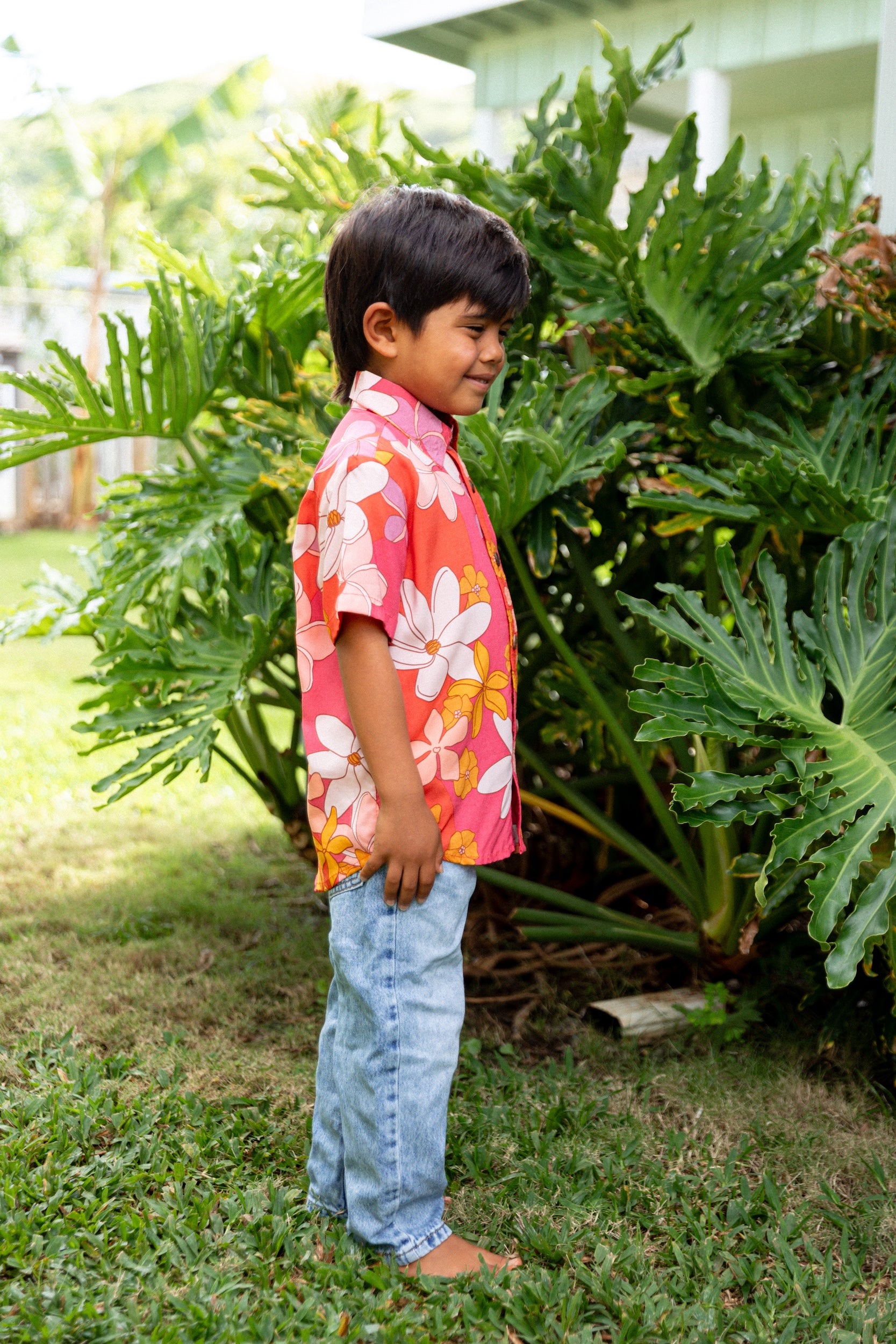 little boy wearing pink mini aloha button up shirt with retro flower print