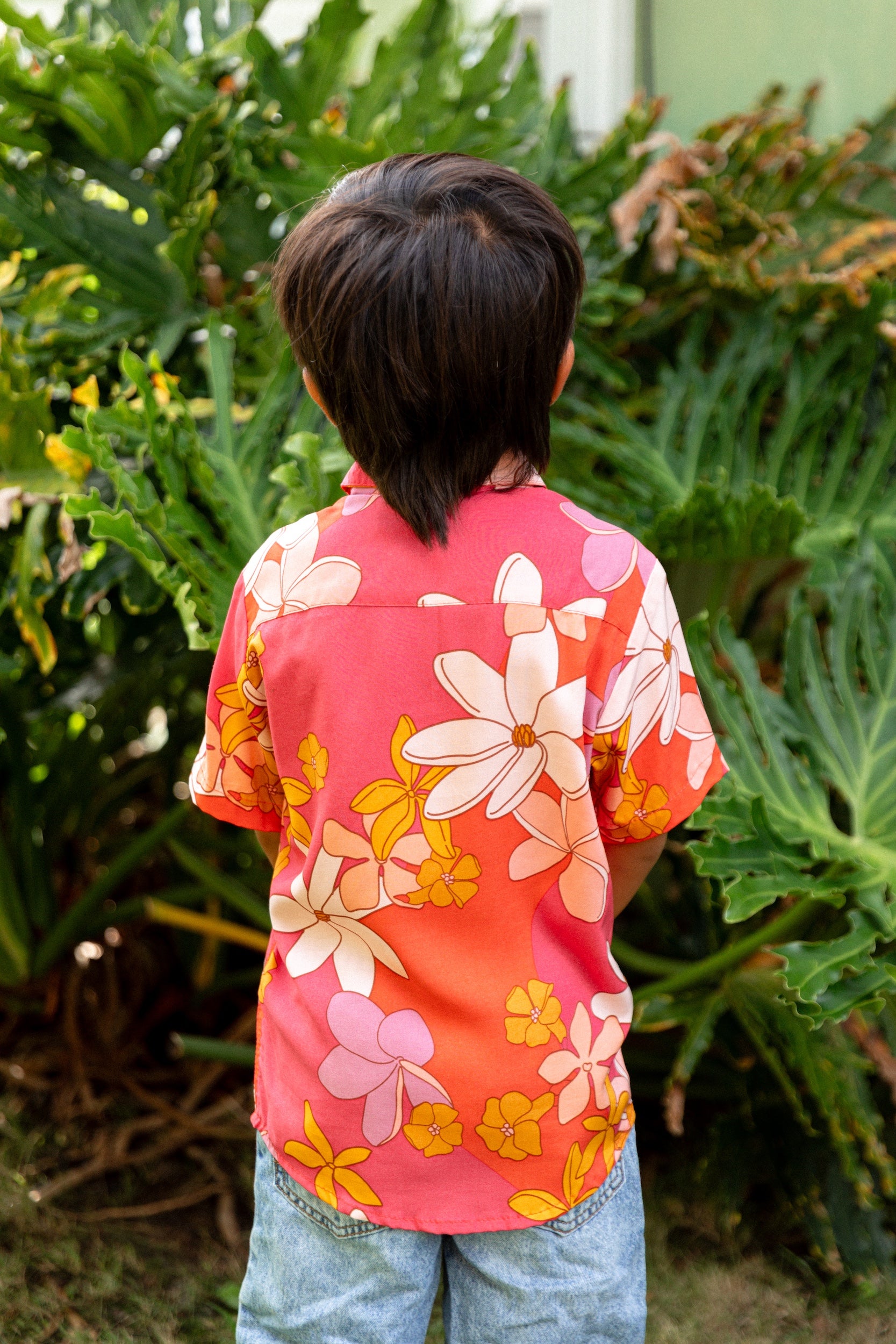 little boy wearing pink mini aloha button up shirt with retro flower print