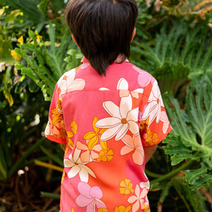 little boy wearing pink mini aloha button up shirt with retro flower print