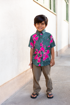 little boy with brown hair wearing mini aloha button up top with fern and ginger print