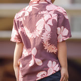 little boy wearing brown aloha shirt with pink lei awapuhi print