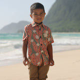 little boy wearing jade colored aloha button up with tiare ginger print