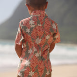 little boy wearing jade colored aloha button up with tiare ginger print