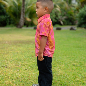 little boy wearing a mini aloha button up shirt in pink with lei pattern