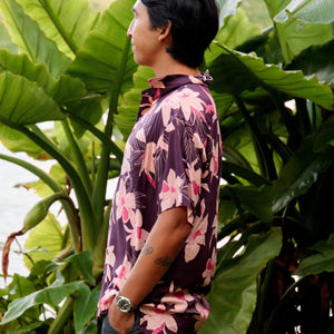 man wearing dark purple aloha shirt with orchid print