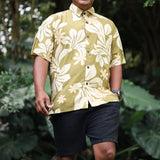 man wearing aloha button up shirt in green print with naupaka pattern