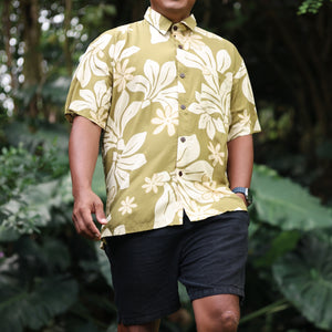 man wearing aloha button up shirt in green print with naupaka pattern