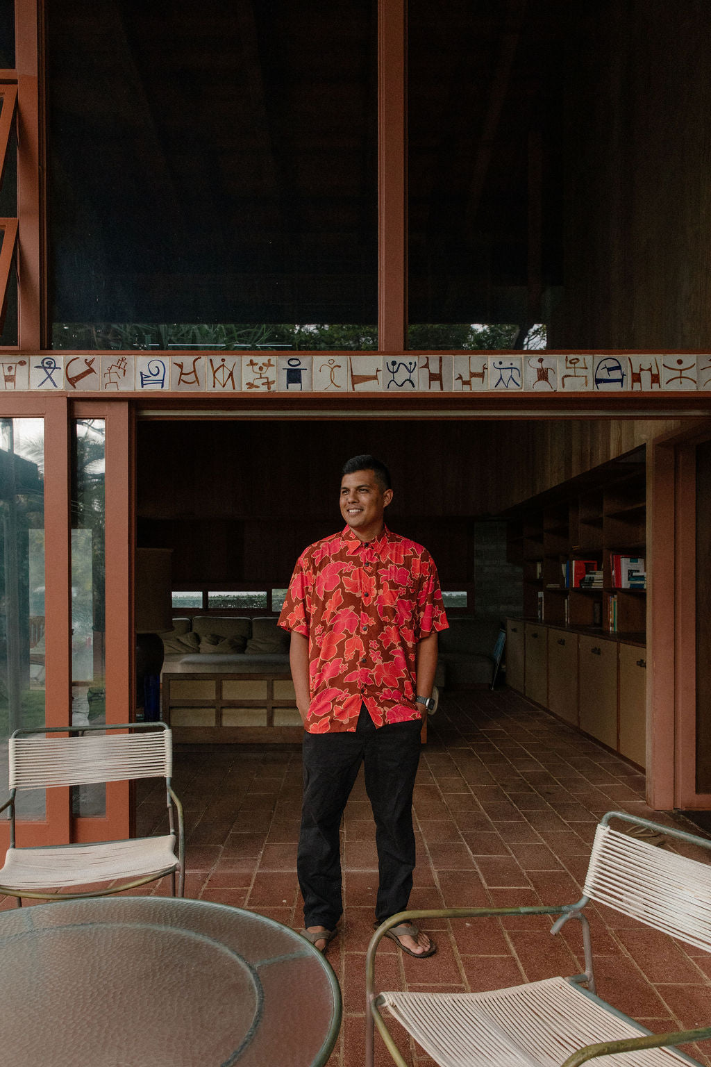 man wearing aloha shirt with vibrant pink pua pattern