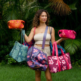 woman carrying wine colored neoprene tote bag with thick straps and detachable pouch with orchid print