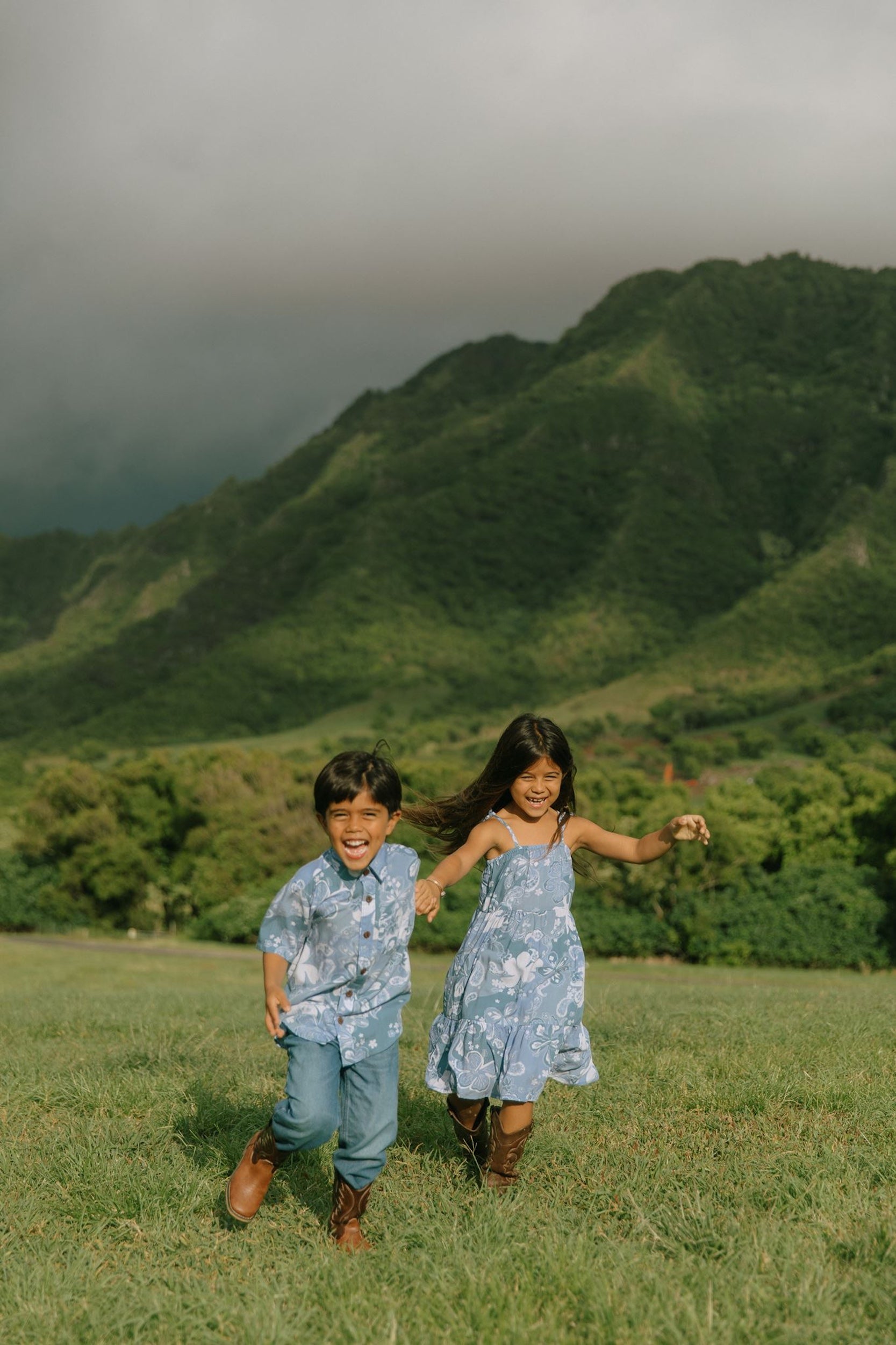 little girl wearing blue paniolo paisley printed dress with tie straps