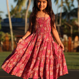 little girl wearing a shell and pua print in pink