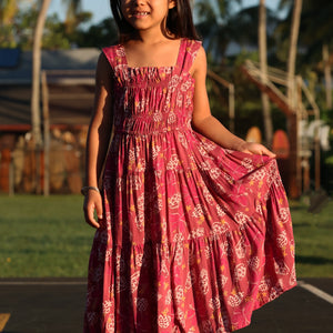 little girl wearing a shell and pua print in pink
