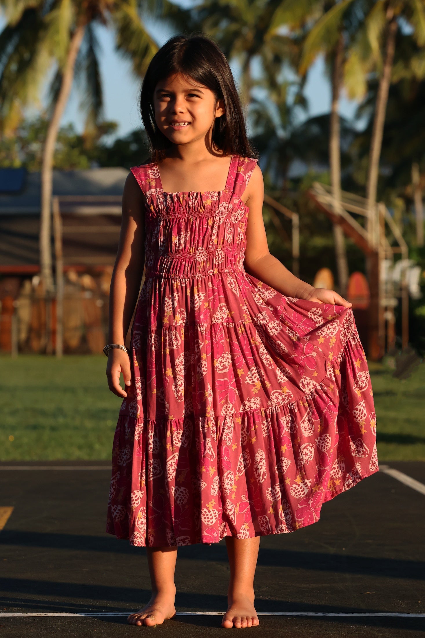little girl wearing a shell and pua print in pink