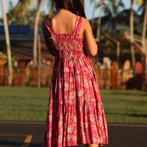 little girl wearing a shell and pua print in pink