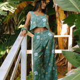 woman wearing lush green square neck crop top with puakenikeni print
