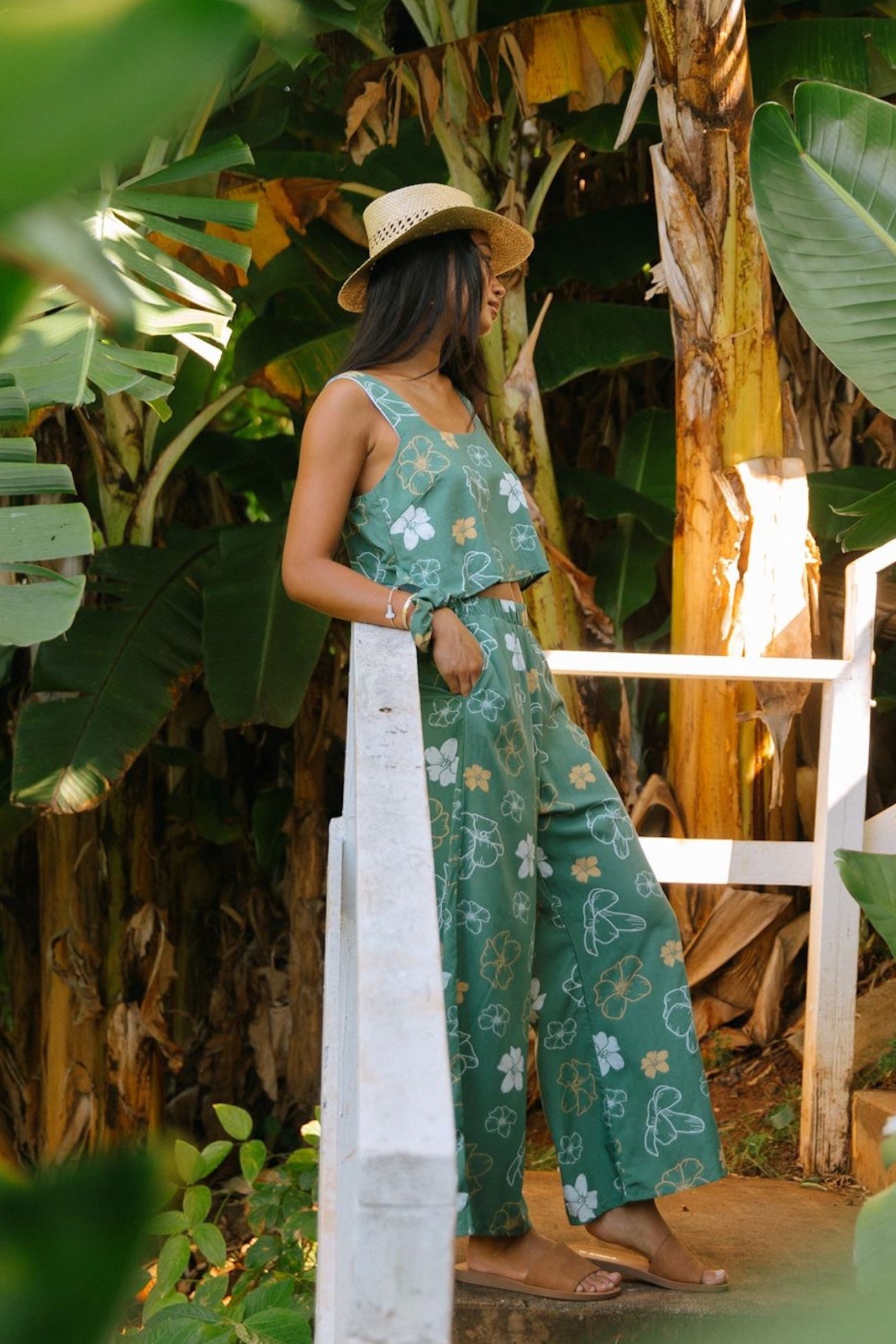 woman wearing lush green square neck crop top with puakenikeni print