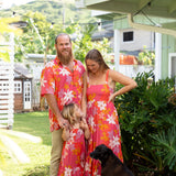 little girl wearing a pink tie strap maxi dress with retro flower pattern