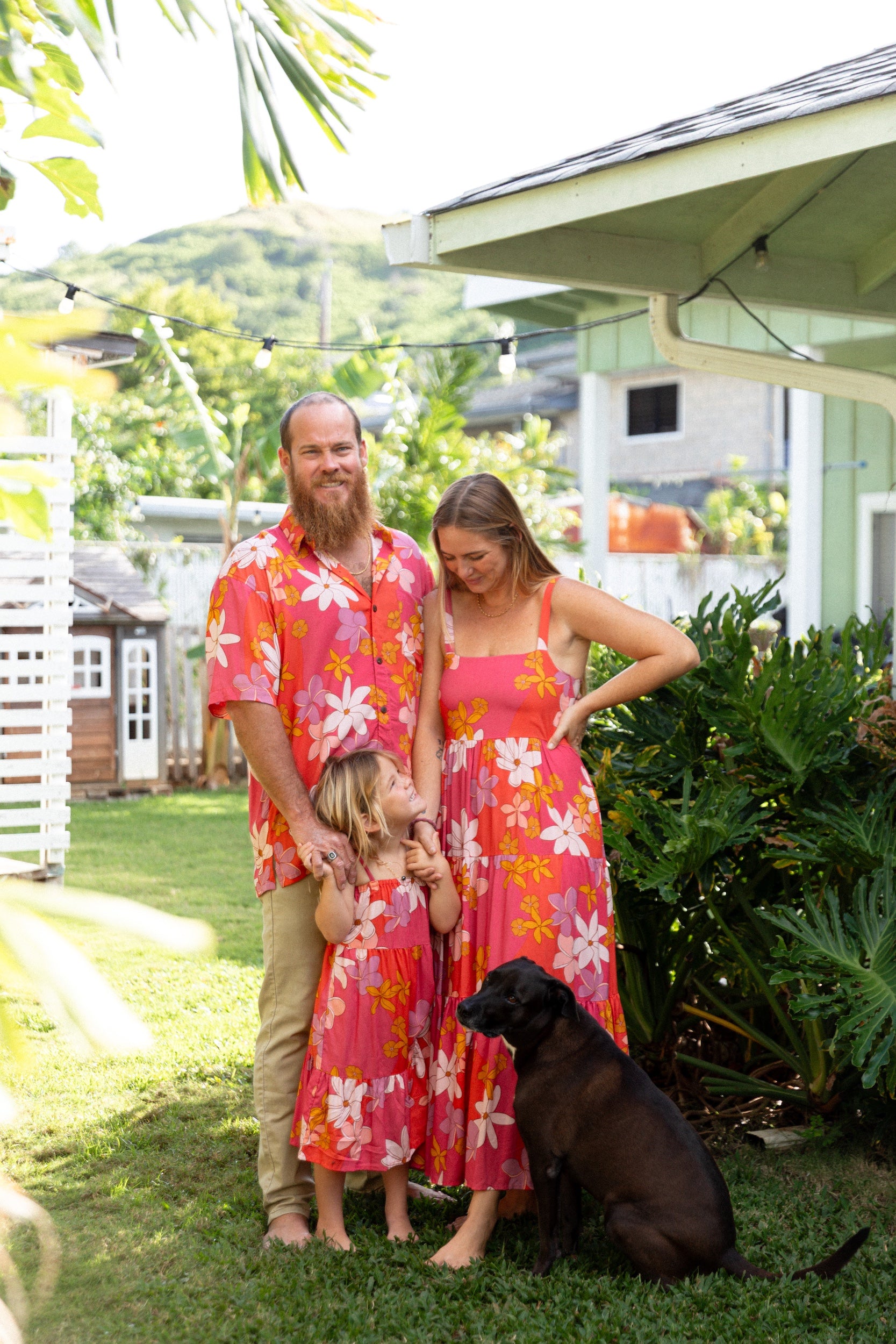 little girl wearing a pink tie strap maxi dress with retro flower pattern