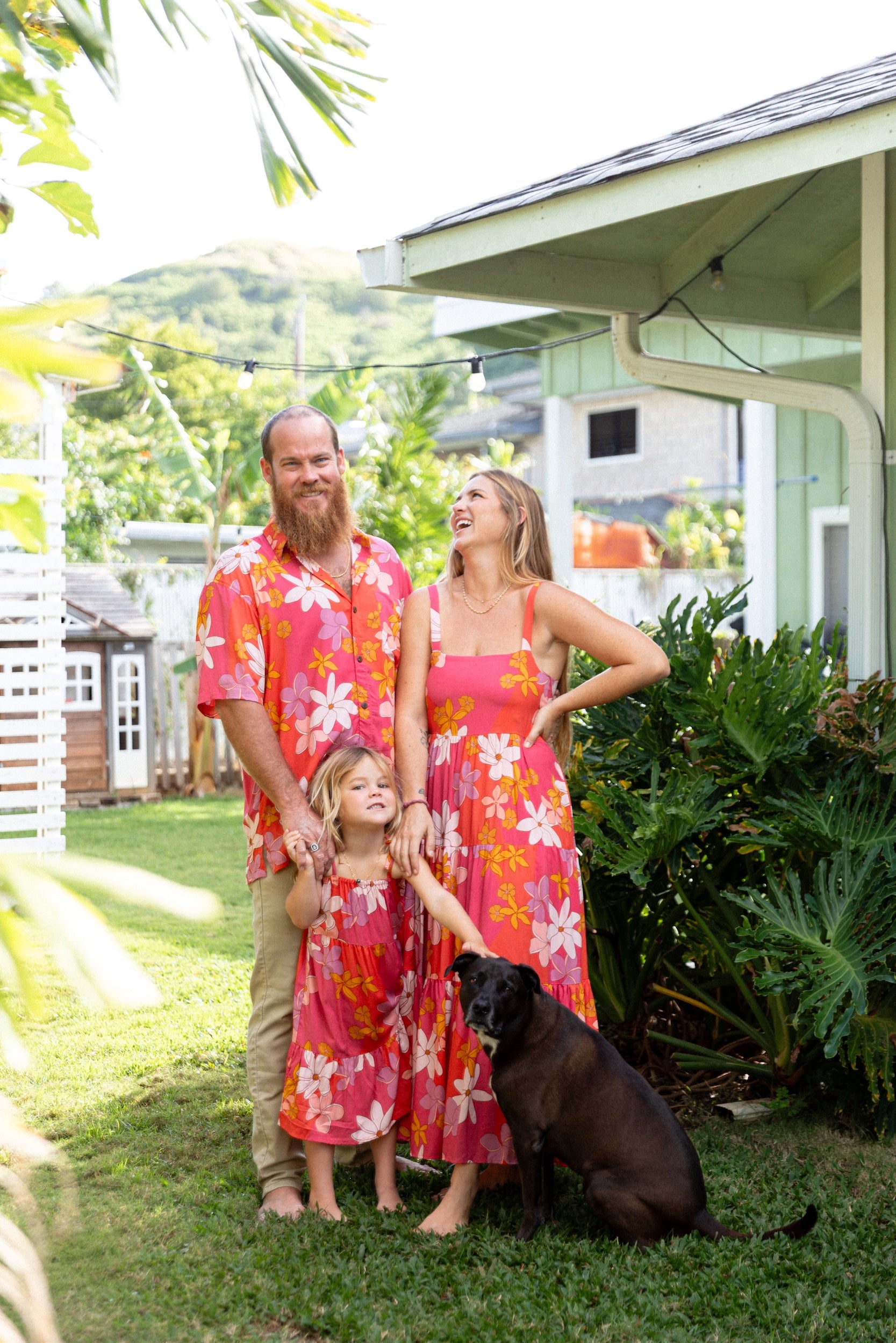 man wearing pink aloha button up shirt with retro flower pattern