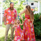 little girl wearing a pink tie strap maxi dress with retro flower pattern