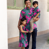 man with brown hair wearing men's aloha button up top with fern and ginger print