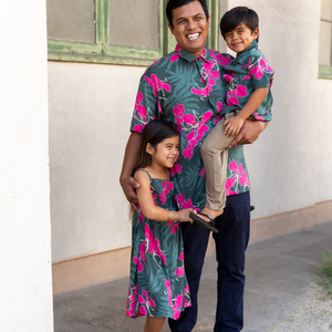 man with brown hair wearing men's aloha button up top with fern and ginger print
