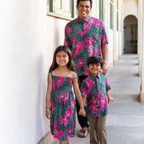 man with brown hair wearing men's aloha button up top with fern and ginger print
