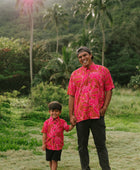 Man and boy in brown button up shirt with large pink floral print