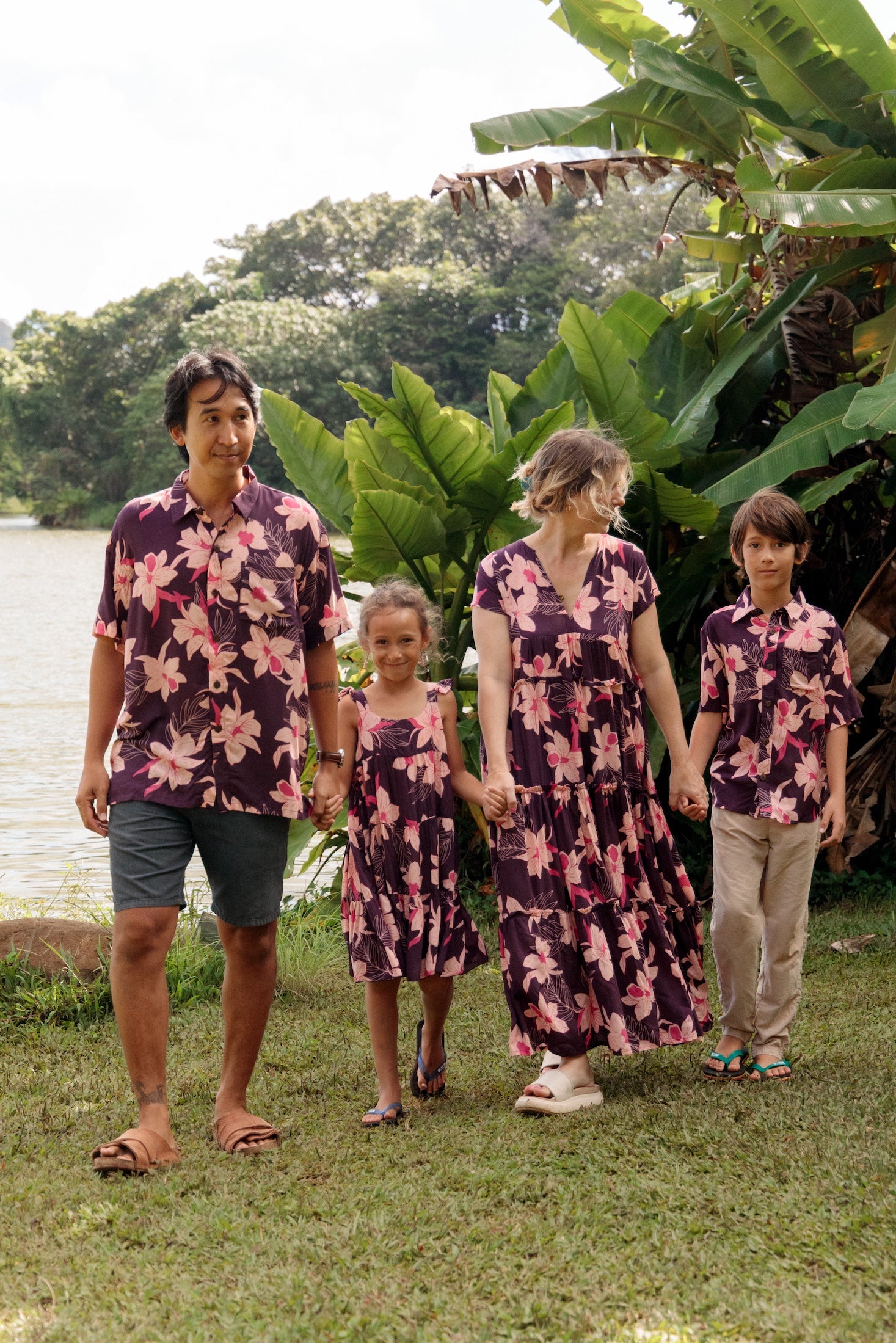 man wearing dark purple aloha shirt with orchid print