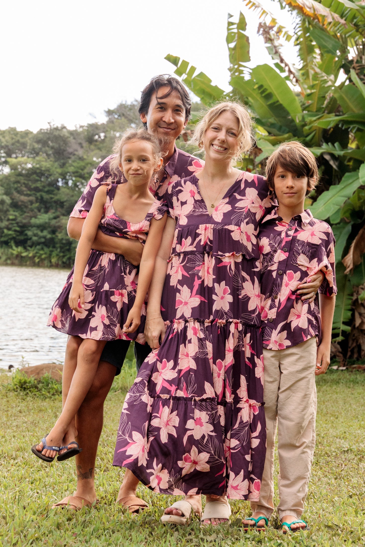 man wearing dark purple aloha shirt with orchid print