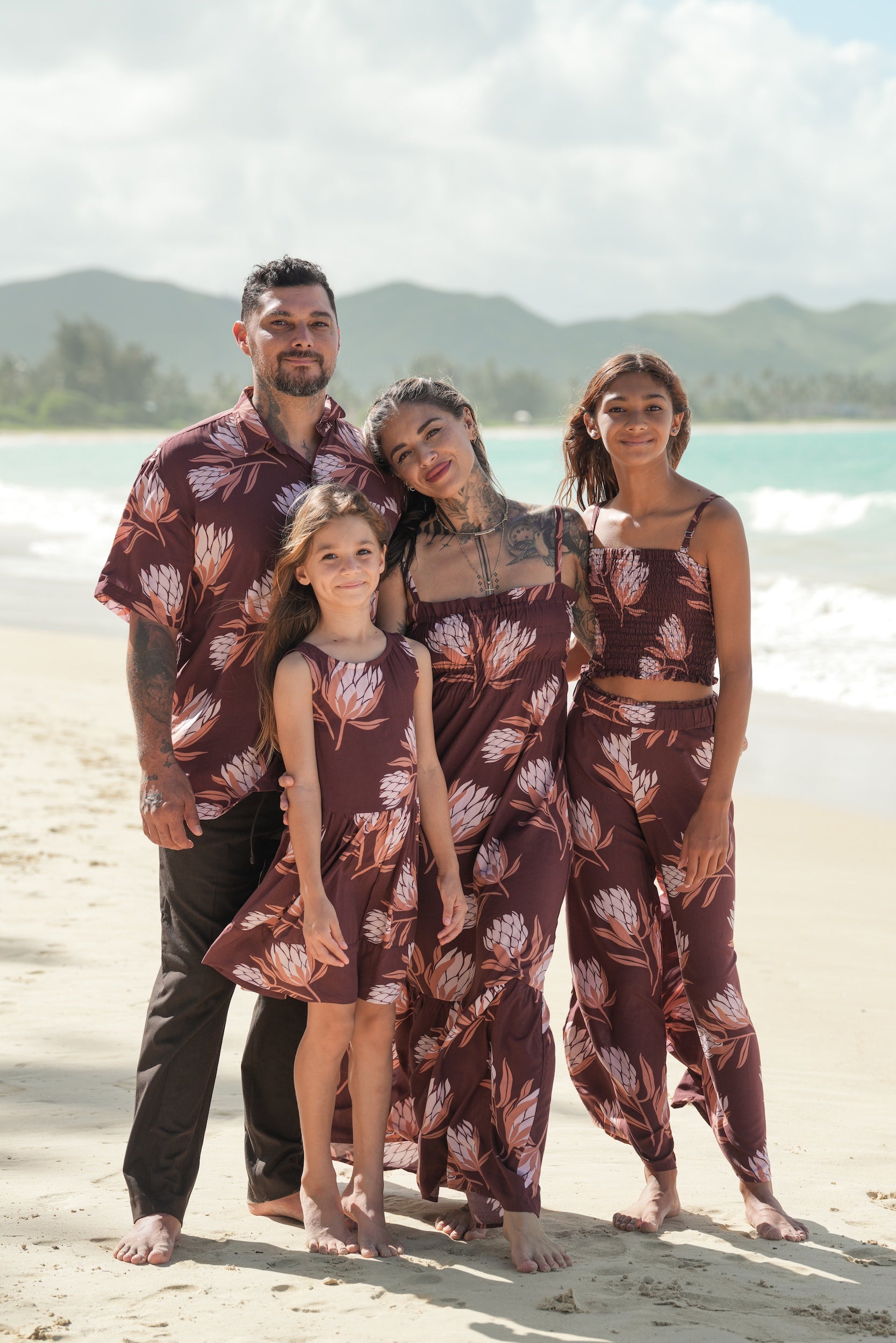 man wearing brown button up aloha shirt with protea print