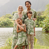 little boy wearing green aloha shirt with native Hawaiian plants