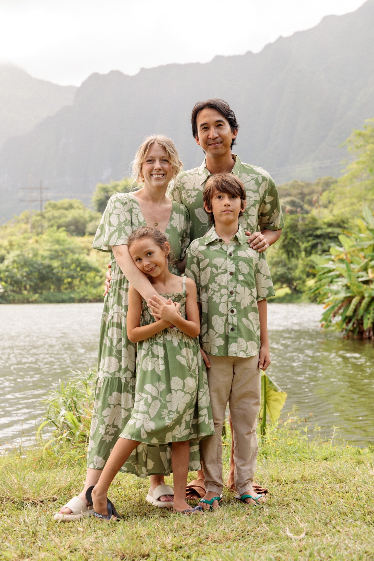 little boy wearing green aloha shirt with native Hawaiian plants
