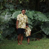 family wearing matching aloha wear in green print with naupaka pattern