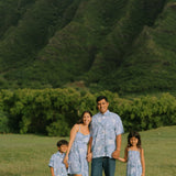 man wearing blue paisley printed aloha button up shirt