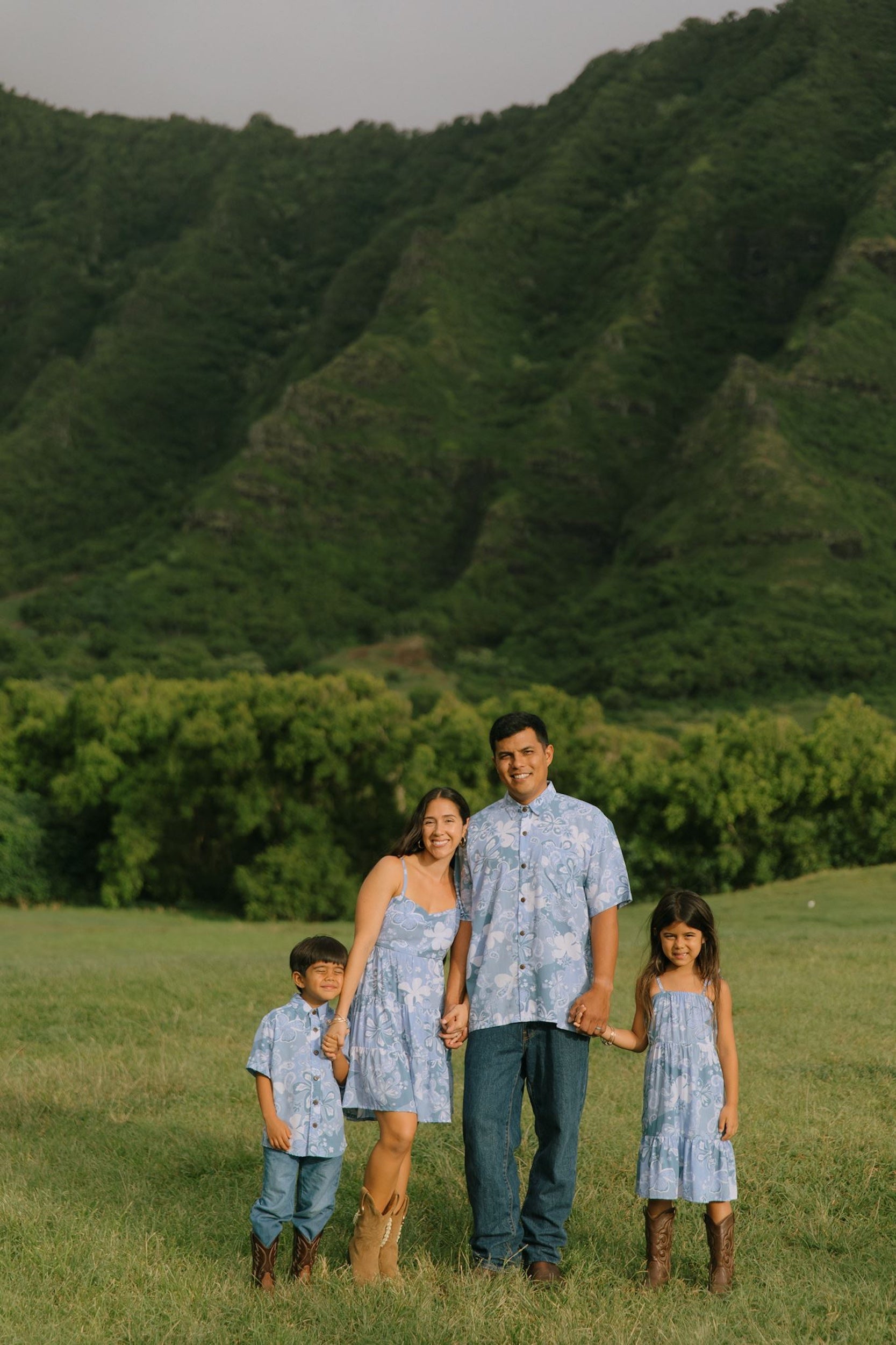man wearing blue paisley printed aloha button up shirt