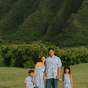man wearing blue paisley printed aloha button up shirt