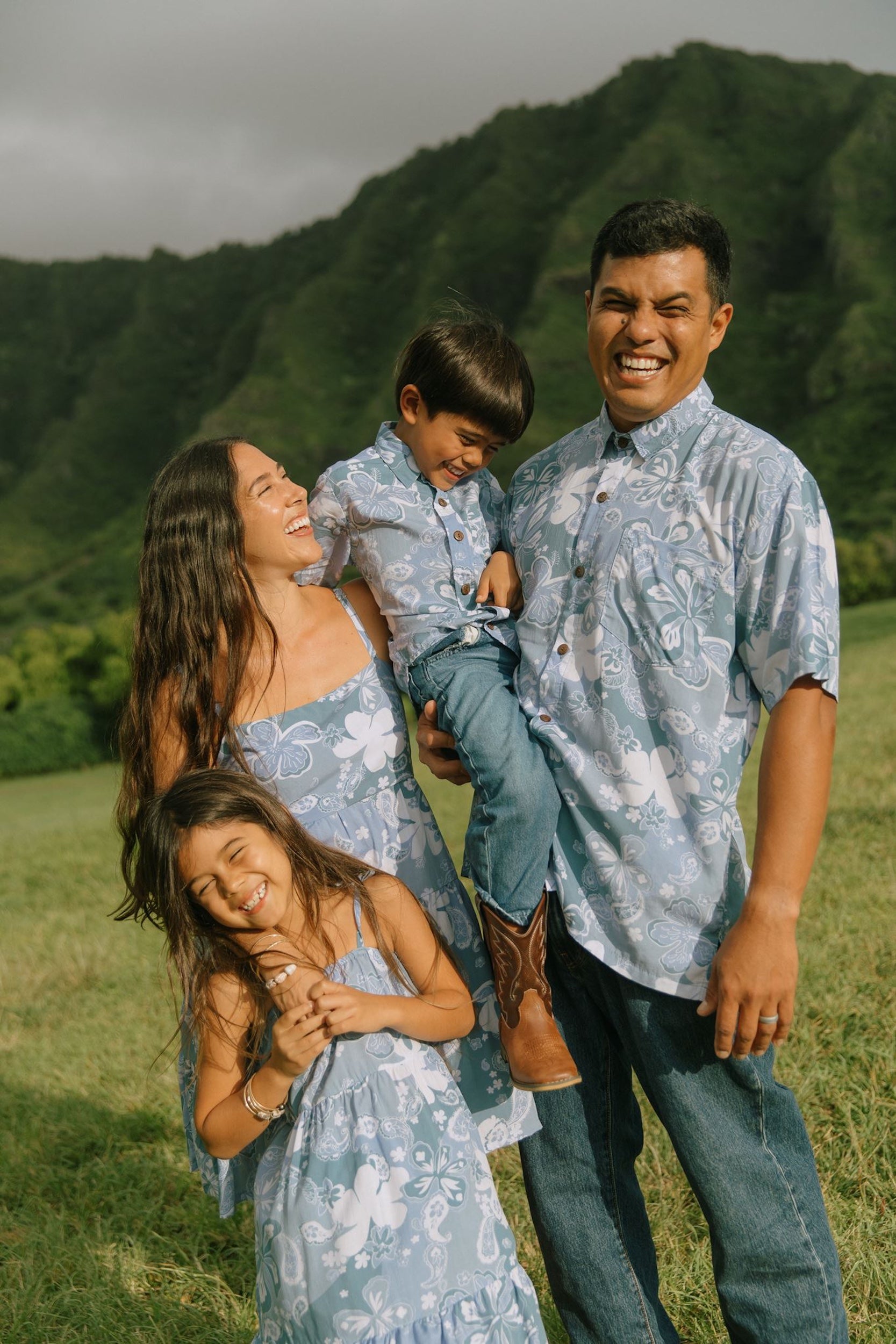 man wearing blue paisley printed aloha button up shirt